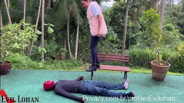 Poster: Evil Lohan aka Mistress Lohan trample feet video - 7 Women Using You As A Doormat