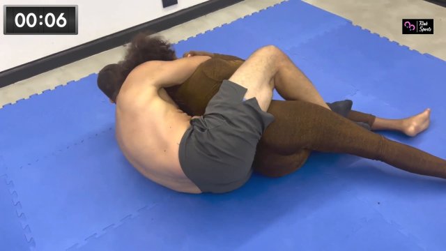 Poster: Kink Sports Ebony Headscissors - Mighty Monica crushes him with her power thigh squeeze